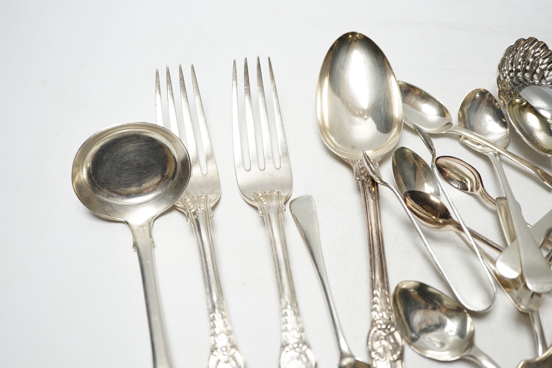 Sundry silver cutlery, including a pair of Victorian Kings pattern table forks and a matching tablespoon, London, 1845, a William IV fiddle pattern sauce ladle and various salt, tea and coffee spoons, 21.9oz and three pl
